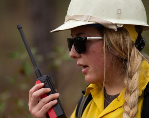 Firefighter talking into a radio